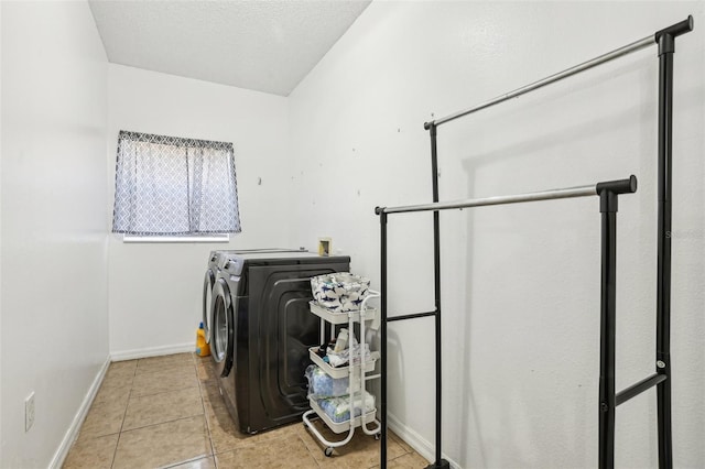 4422 Evergreen Forest Loop, Kissimmee, FL 34758 - laundry area featuring washer and clothes dryer, baseboards, and tile patterned flooring