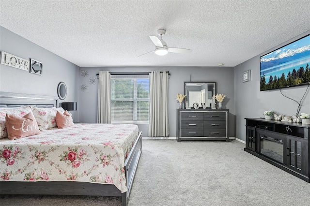 4422 Evergreen Forest Loop, Kissimmee, FL 34758 - bedroom featuring light colored carpet, a ceiling fan, a textured ceiling, and baseboards