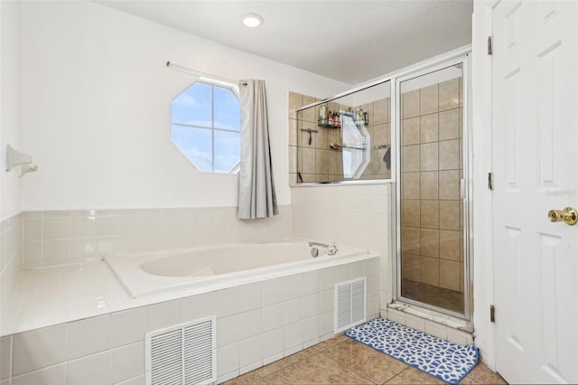 4422 Evergreen Forest Loop, Kissimmee, FL 34758 - full bathroom featuring a stall shower, a garden tub, and tile patterned flooring