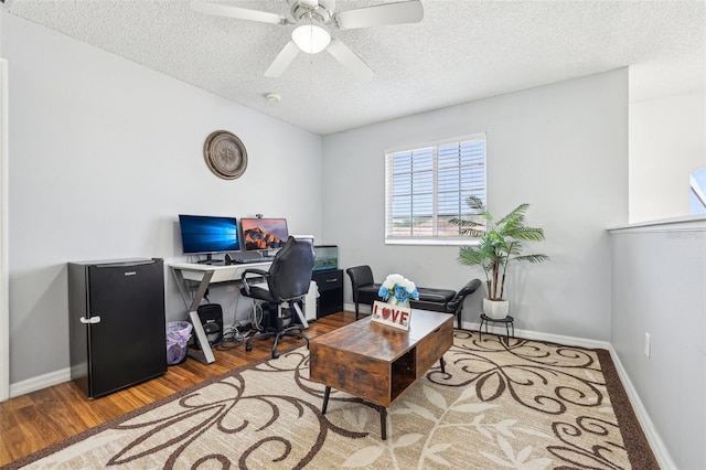 4422 Evergreen Forest Loop, Kissimmee, FL 34758 - office with a textured ceiling, wood finished floors, a ceiling fan, and baseboards