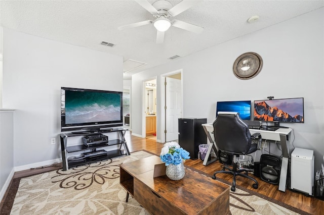 4422 Evergreen Forest Loop, Kissimmee, FL 34758 - office area featuring wood finished floors, ceiling fan, baseboards, a textured ceiling, and attic access