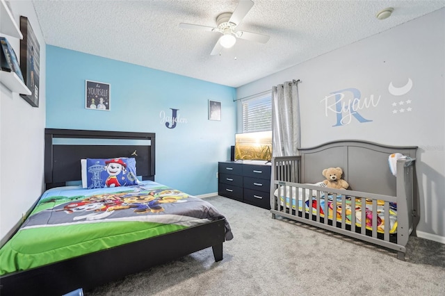 4422 Evergreen Forest Loop, Kissimmee, FL 34758 - bedroom with carpet floors, a textured ceiling, a ceiling fan, and baseboards
