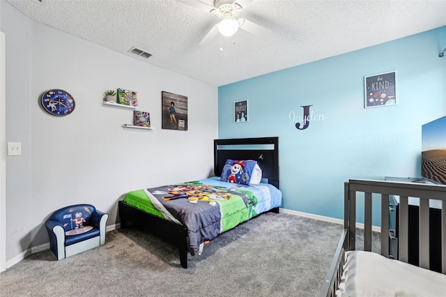 4422 Evergreen Forest Loop, Kissimmee, FL 34758 - carpeted bedroom with a textured ceiling, baseboards, and a ceiling fan