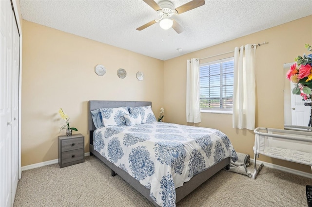 4422 Evergreen Forest Loop, Kissimmee, FL 34758 - carpeted bedroom with a textured ceiling, baseboards, and a ceiling fan
