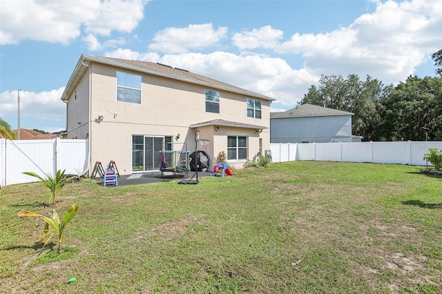 4422 Evergreen Forest Loop, Kissimmee, FL 34758 - back of house with stucco siding and a patio