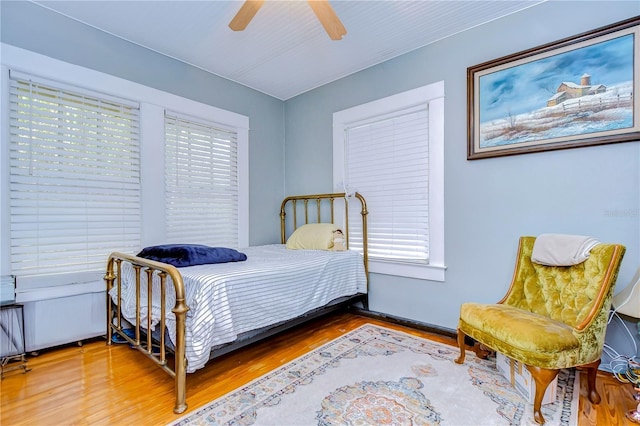902 W Columbus Dr, Tampa, FL 33602 - bedroom featuring multiple windows, wood finished floors, and ceiling fan
