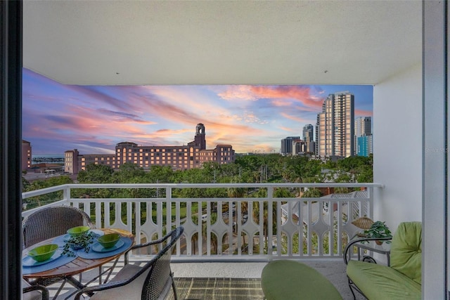 700 Beach Dr NE Unit 704, Saint Petersburg, FL 33701 - balcony at dusk featuring a city view