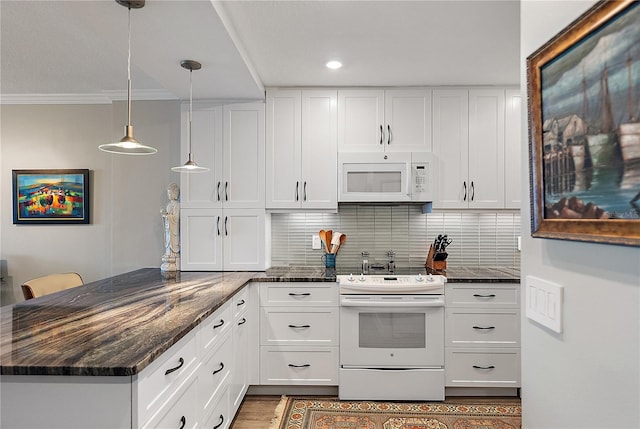 700 Beach Dr NE Unit 704, Saint Petersburg, FL 33701 - kitchen with white appliances, a peninsula, white cabinets, ornamental molding, and recessed lighting