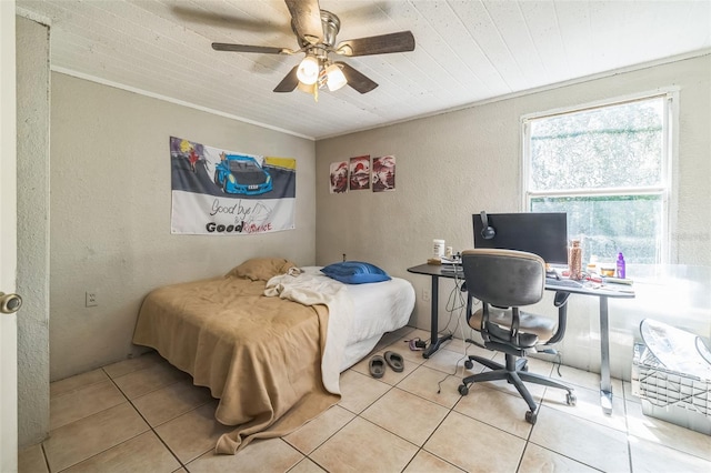 797 Hwy Unit 196, Cantonment, FL 32533 - bedroom featuring a textured wall, tile patterned flooring, an office area, a ceiling fan, and crown molding
