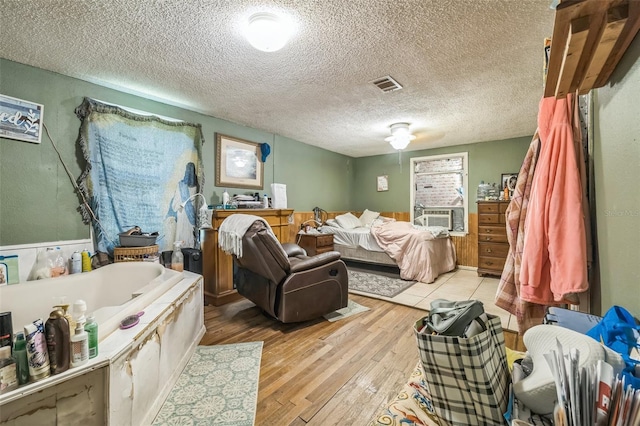 797 Hwy Unit 196, Cantonment, FL 32533 - bedroom with light wood-type flooring and a textured ceiling
