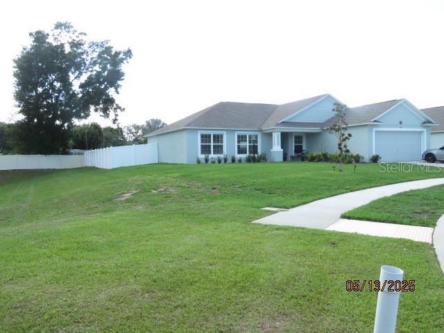 206 Samantha Ave, Auburndale, FL 33823 - ranch-style house featuring an attached garage