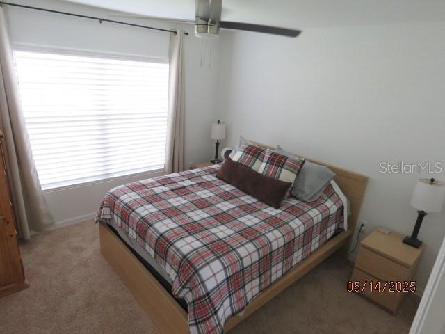 206 Samantha Ave, Auburndale, FL 33823 - carpeted bedroom with baseboards and ceiling fan