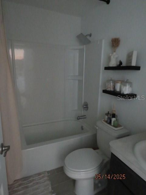 206 Samantha Ave, Auburndale, FL 33823 - full bathroom featuring shower / bathtub combination, vanity, toilet, and tile patterned floors
