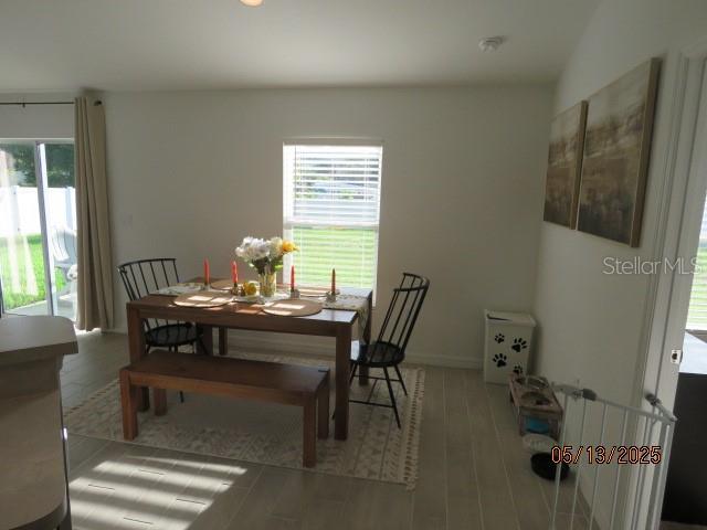 206 Samantha Ave, Auburndale, FL 33823 - dining space featuring healthy amount of natural light and wood finished floors