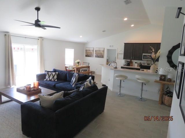 206 Samantha Ave, Auburndale, FL 33823 - living area featuring ceiling fan, lofted ceiling, and recessed lighting