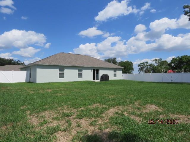 206 Samantha Ave, Auburndale, FL 33823 - rear view of house with stucco siding