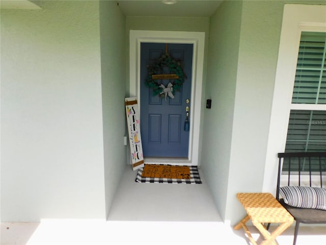 206 Samantha Ave, Auburndale, FL 33823 - doorway to property featuring stucco siding