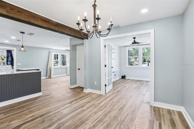 5632 Indiana Ave, New Port Richey, FL 34652 - unfurnished dining area featuring a ceiling fan, light wood-type flooring, a chandelier, healthy amount of natural light, and recessed lighting