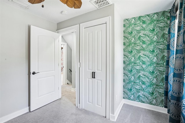 5632 Indiana Ave, New Port Richey, FL 34652 - unfurnished bedroom with baseboards, carpet floors, a closet, and ceiling fan