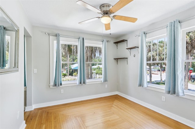 5632 Indiana Ave, New Port Richey, FL 34652 - unfurnished room featuring plenty of natural light, ceiling fan, and baseboards