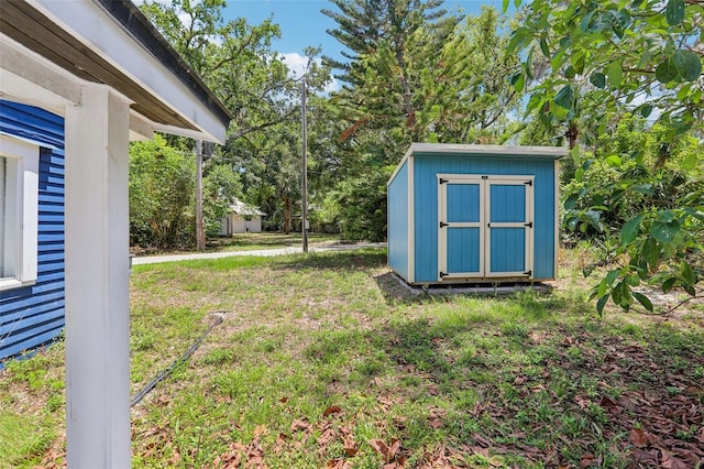 5632 Indiana Ave, New Port Richey, FL 34652 - view of grassy yard with a shed and an outdoor structure