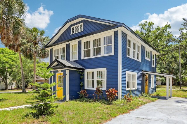 5632 Indiana Ave, New Port Richey, FL 34652 - view of front of property with a front lawn