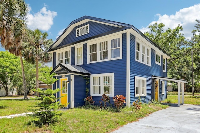 5632 Indiana Ave, New Port Richey, FL 34652 - view of front of house with a front yard