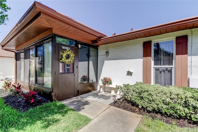 2380 Shelly Dr Unit B, Palm Harbor, FL 34684 - view of exterior entry featuring stucco siding