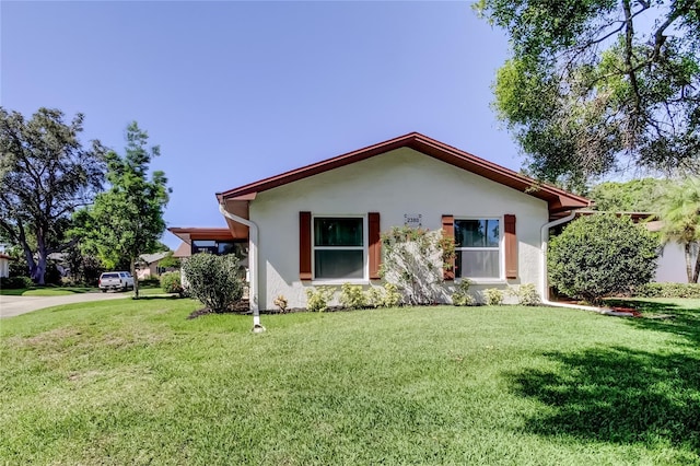 2380 Shelly Dr Unit B, Palm Harbor, FL 34684 - single story home with stucco siding and a front lawn