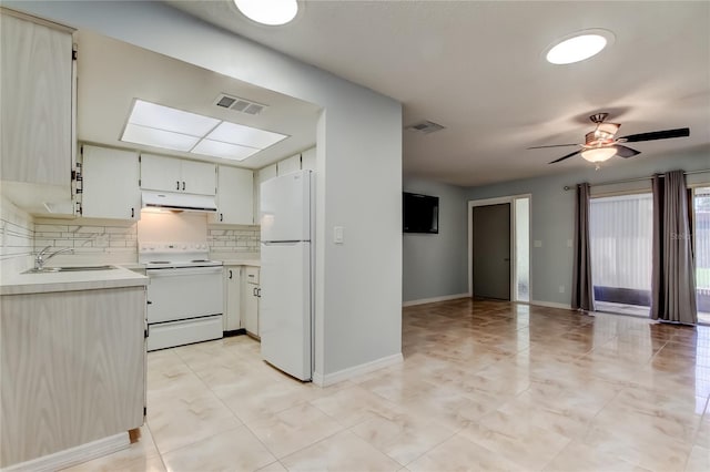 2380 Shelly Dr Unit B, Palm Harbor, FL 34684 - kitchen with white appliances, exhaust hood, a sink, light countertops, and decorative backsplash