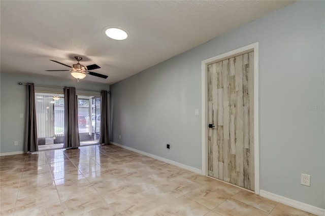 2380 Shelly Dr Unit B, Palm Harbor, FL 34684 - unfurnished room featuring ceiling fan, baseboards, and light tile patterned flooring