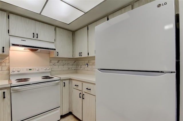 2380 Shelly Dr Unit B, Palm Harbor, FL 34684 - kitchen with white appliances, under cabinet range hood, light countertops, and backsplash