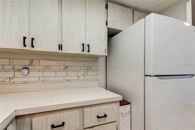 2380 Shelly Dr Unit B, Palm Harbor, FL 34684 - kitchen view of freestanding refrigerator, backsplash, and light countertops