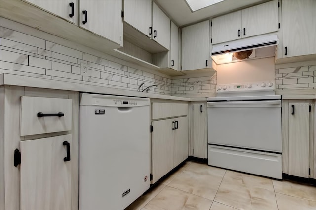 2380 Shelly Dr Unit B, Palm Harbor, FL 34684 - kitchen featuring white appliances, under cabinet range hood, light countertops, decorative backsplash, and light tile patterned floors