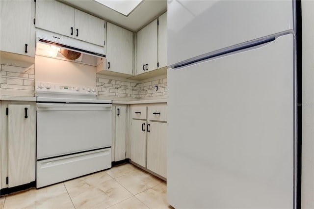 2380 Shelly Dr Unit B, Palm Harbor, FL 34684 - kitchen featuring white appliances, light countertops, decorative backsplash, and light tile patterned floors