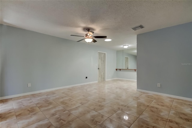 2380 Shelly Dr Unit B, Palm Harbor, FL 34684 - empty room with light tile patterned floors, a ceiling fan, a textured ceiling, and baseboards