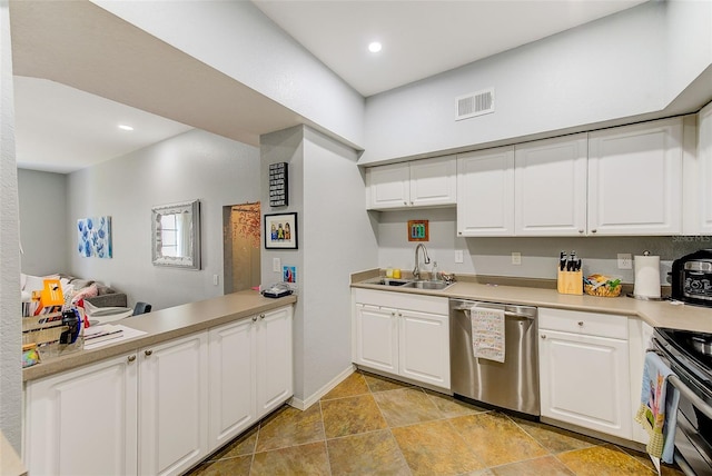 402 S Armenia Ave Unit 139A, Tampa, FL 33609 - kitchen featuring stainless steel appliances, a sink, white cabinets, light countertops, and recessed lighting