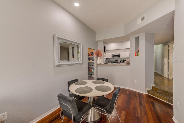 402 S Armenia Ave Unit 139A, Tampa, FL 33609 - dining space featuring wood finished floors and baseboards