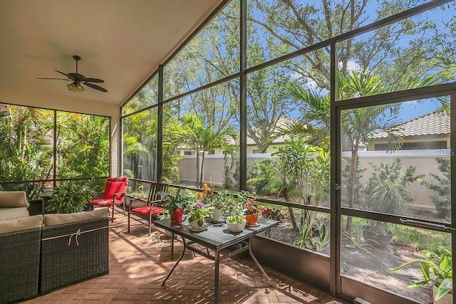 sunroom with an outdoor living space, ceiling fan, and lofted ceiling