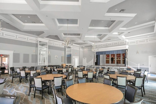 dining room featuring a towering ceiling, coffered ceiling, and beam ceiling