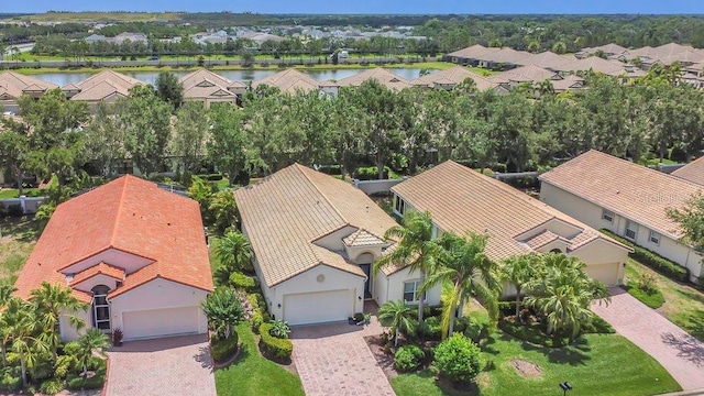 aerial perspective of suburban area with a large body of water