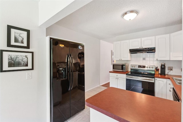 kitchen with stainless steel appliances, under cabinet range hood, white cabinetry, tasteful backsplash, and a textured ceiling