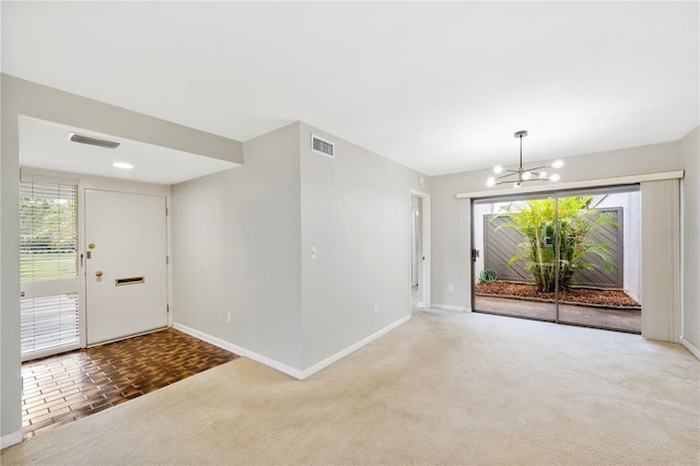 4006 Cypress Ln Unit 4006, Tampa, FL 33618 - carpeted foyer entrance featuring a chandelier and baseboards