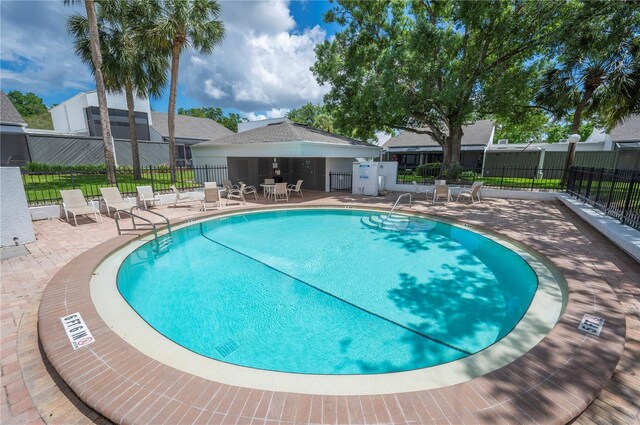 4006 Cypress Ln Unit 4006, Tampa, FL 33618 - view of swimming pool featuring fence and a patio