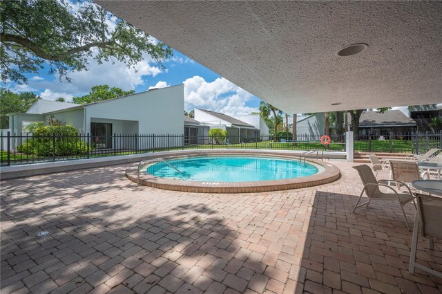 4006 Cypress Ln Unit 4006, Tampa, FL 33618 - community pool with a patio area and fence