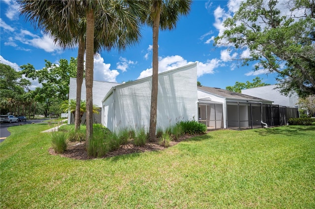 4006 Cypress Ln Unit 4006, Tampa, FL 33618 - view of home's exterior with a lawn and stucco siding