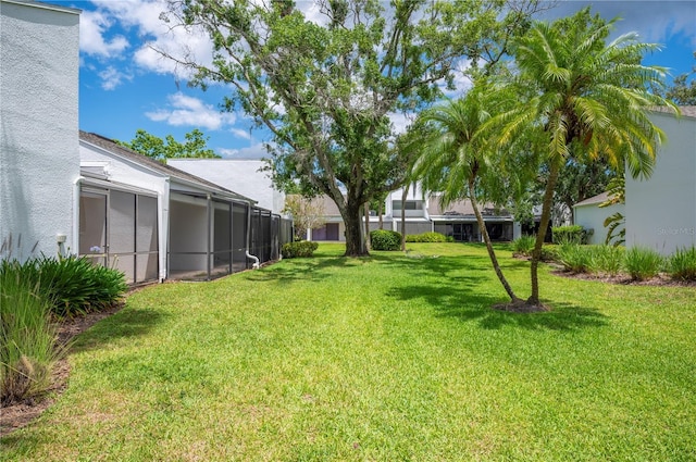 4006 Cypress Ln Unit 4006, Tampa, FL 33618 - view of grassy yard featuring glass enclosure