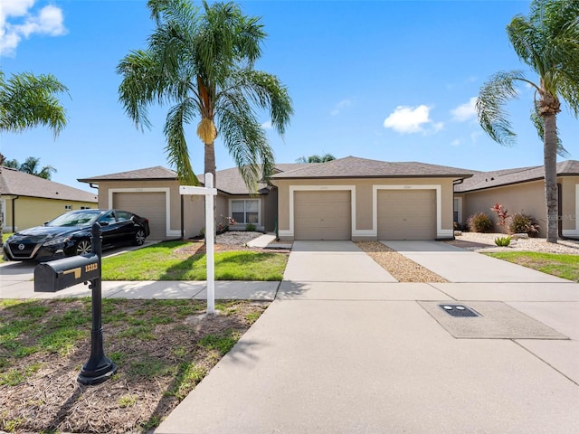 13313 Ashbark Ct, Riverview, FL 33579 - ranch-style house with stucco siding, driveway, and a garage