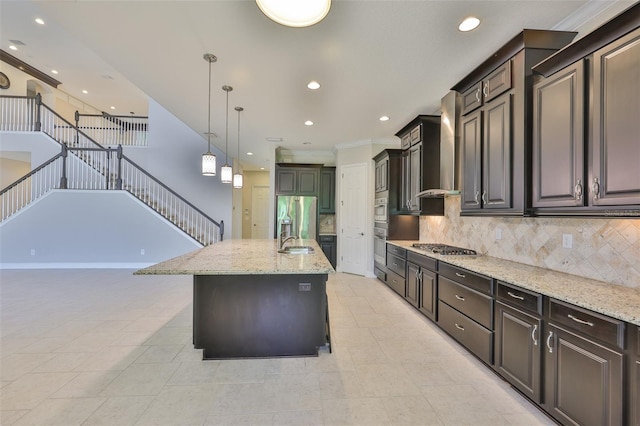 kitchen with appliances with stainless steel finishes, light stone counters, decorative backsplash, recessed lighting, and pendant lighting
