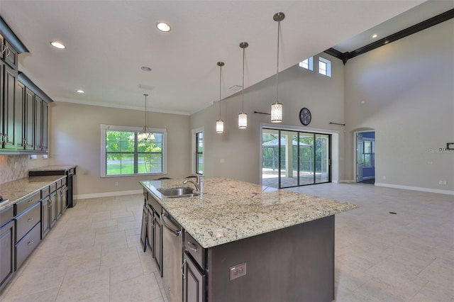 kitchen with a sink, crown molding, baseboards, dishwasher, and recessed lighting